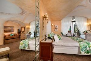 a bedroom with two beds in a room at Palazzo Marziale in Sorrento