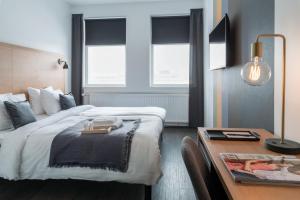 Postel nebo postele na pokoji v ubytování 201 Hotel