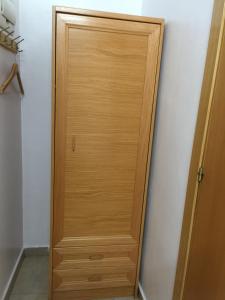 a wooden closet door in a room at Hostal Mont Thabor in Barcelona
