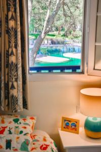 En eller flere senge i et værelse på Cottage 40 **** Beach Golf Surf à pieds