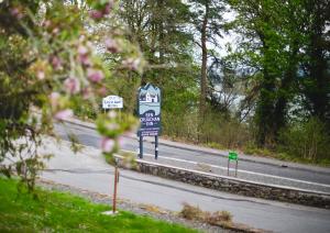 a street sign on the side of a road at Ben Cruachan Inn - Restaurant, Pub with Rooms in Loch Awe