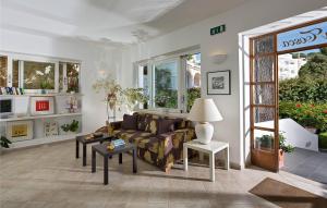 a living room with a couch and a table at Hotel La Tosca in Capri