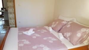 Postel nebo postele na pokoji v ubytování Apartmani I & J Šerić