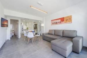 a living room with a couch and a table at Apartment Lauet in Port de Pollensa