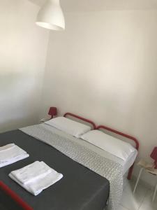 Krevet ili kreveti u jedinici u objektu Appartamenti Le Mimose