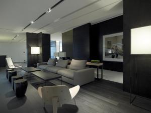 a living room with a couch and a table at The Met Hotel Thessaloniki, a Member of Design Hotels in Thessaloniki
