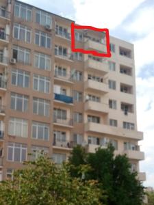 a building with a red object in front of it at var-ketili in Tbilisi City