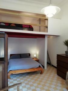 a bedroom with a bed and a bunk bed at L'escale in Marseille