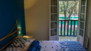 En eller flere senge i et værelse på Cottage 40 **** Beach Golf Surf à pieds + 37 billeder