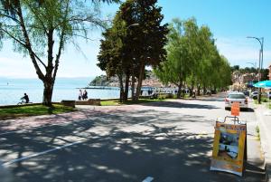 a street with a sign on the side of the road at Vila Delfin in Ohrid