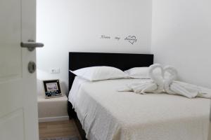 Postel nebo postele na pokoji v ubytování Apartment Pino