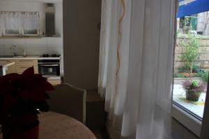 Kuchyň nebo kuchyňský kout v ubytování Apartment Pino