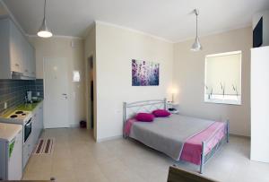 A bed or beds in a room at Lalezas Studios
