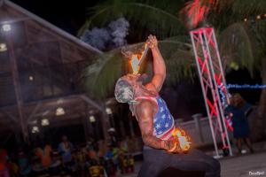 a man is doing a trick on a skateboard at Charlestina Beach Resort in Ampeni