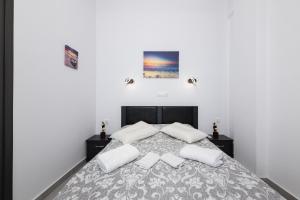 Postel nebo postele na pokoji v ubytování Akrogiali Apartments