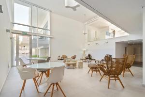 a dining room with a table and chairs at Carihuela Suites in Torremolinos