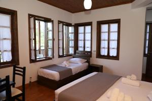 Postel nebo postele na pokoji v ubytování Hotel Demaj