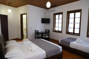 Postel nebo postele na pokoji v ubytování Hotel Demaj