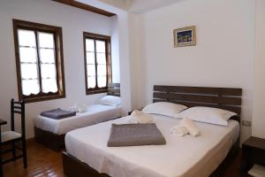 Postel nebo postele na pokoji v ubytování Hotel Demaj