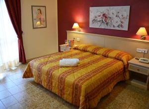 Postel nebo postele na pokoji v ubytování Hotel Vallisdea