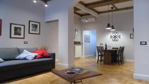 a living room with a couch and a table at Duomo Classic Apartment in Florence