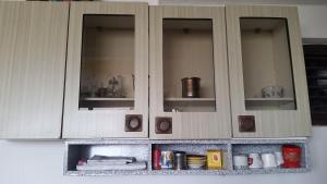 a kitchen with white cabinets with a counter top at Guesthouse Ada in Bar