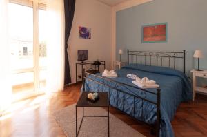 Ένα ή περισσότερα κρεβάτια σε δωμάτιο στο B&B Cento Passi Dalle Mura