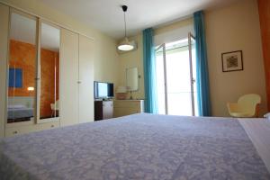 Postel nebo postele na pokoji v ubytování Grand Hotel Excelsior