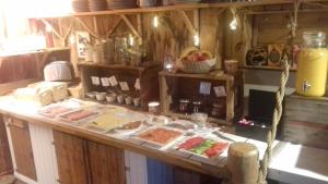 a counter with meat and other food on it at Holmvik Brygge Nyksund in Nyksund