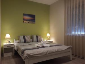 Llit o llits en una habitació de Vila & Apartments MATEA