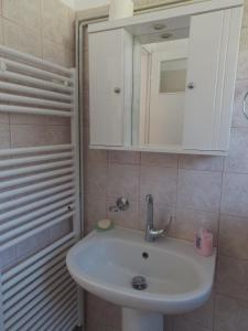 a bathroom with a sink and a mirror at Art Flowers and Culture in Mystras