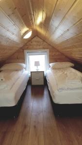 Voodi või voodid majutusasutuse Starmýri 2 Cottages toas