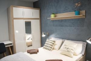 Letto o letti in una camera di Sunshine Suites