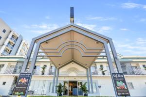 a building in front of a building at Coral Tree Inn in Cairns