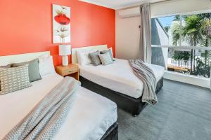 Katil atau katil-katil dalam bilik di Coral Tree Inn