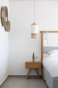 Rúm í herbergi á Messinian Icon Hotel & Suites