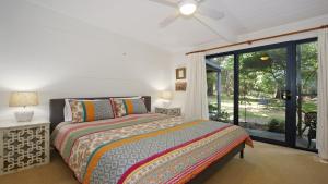 a bedroom with a bed and a large window at Bright River Rest in Bright +21 photos
