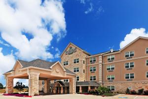 uma representação de um hotel com um edifício em Country Inn & Suites by Radisson, Texarkana, TX em Texarkana - Texas