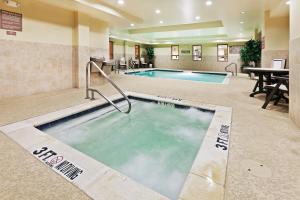 a hot tub in the middle of a hotel room at Country Inn & Suites by Radisson, Texarkana, TX in Texarkana