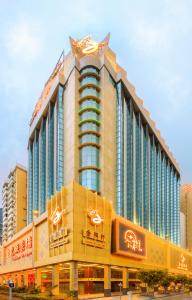 a large building with signs on the side of it at Hotel Golden Dragon in Macau