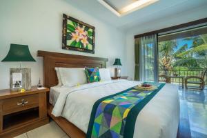 Una cama o camas en una habitación de Gita Maha Ubud Hotel by Mahaputra-CHSE Certified