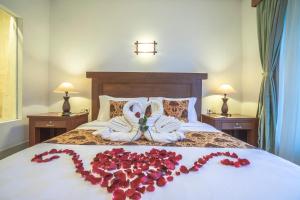 A bed or beds in a room at Gita Maha Ubud Hotel by Mahaputra-CHSE Certified