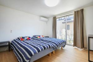 Voodi või voodid majutusasutuse koiwa house 3LDK free wifi free parking toas