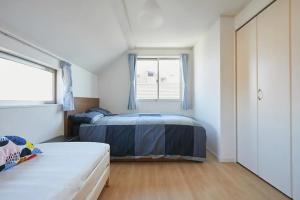 Voodi või voodid majutusasutuse koiwa house 3LDK free wifi free parking toas