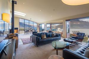 a living room with a couch and a table at London Lane in Queenstown