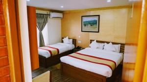 Voodi või voodid majutusasutuse Kathmandu Garden Home toas
