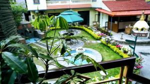 a view of a garden from a balcony at Kathmandu Garden Home in Kathmandu