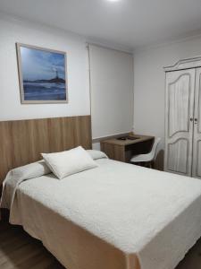 Giường trong phòng chung tại Hotel La Posada