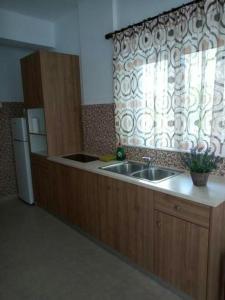 
A kitchen or kitchenette at Maria Studios and Apartments
