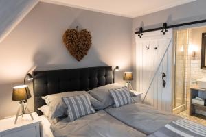 Postel nebo postele na pokoji v ubytování Friesen-Lodge Apartments